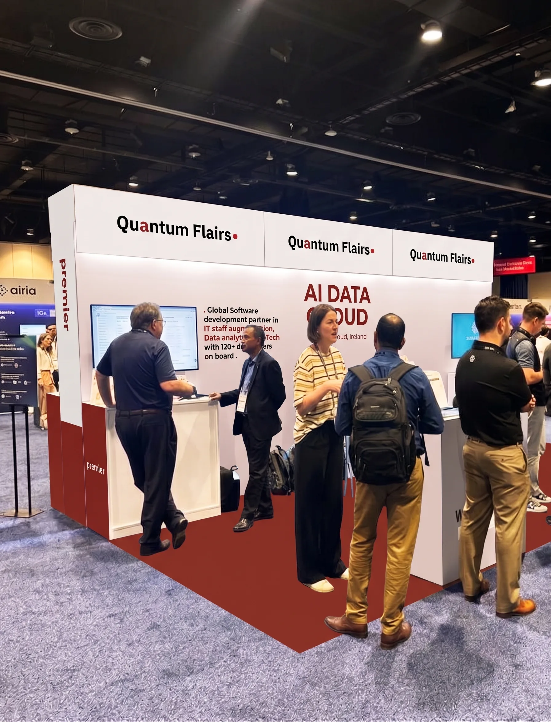 Visitors speaking with Quantum Flairs representatives at a conference booth