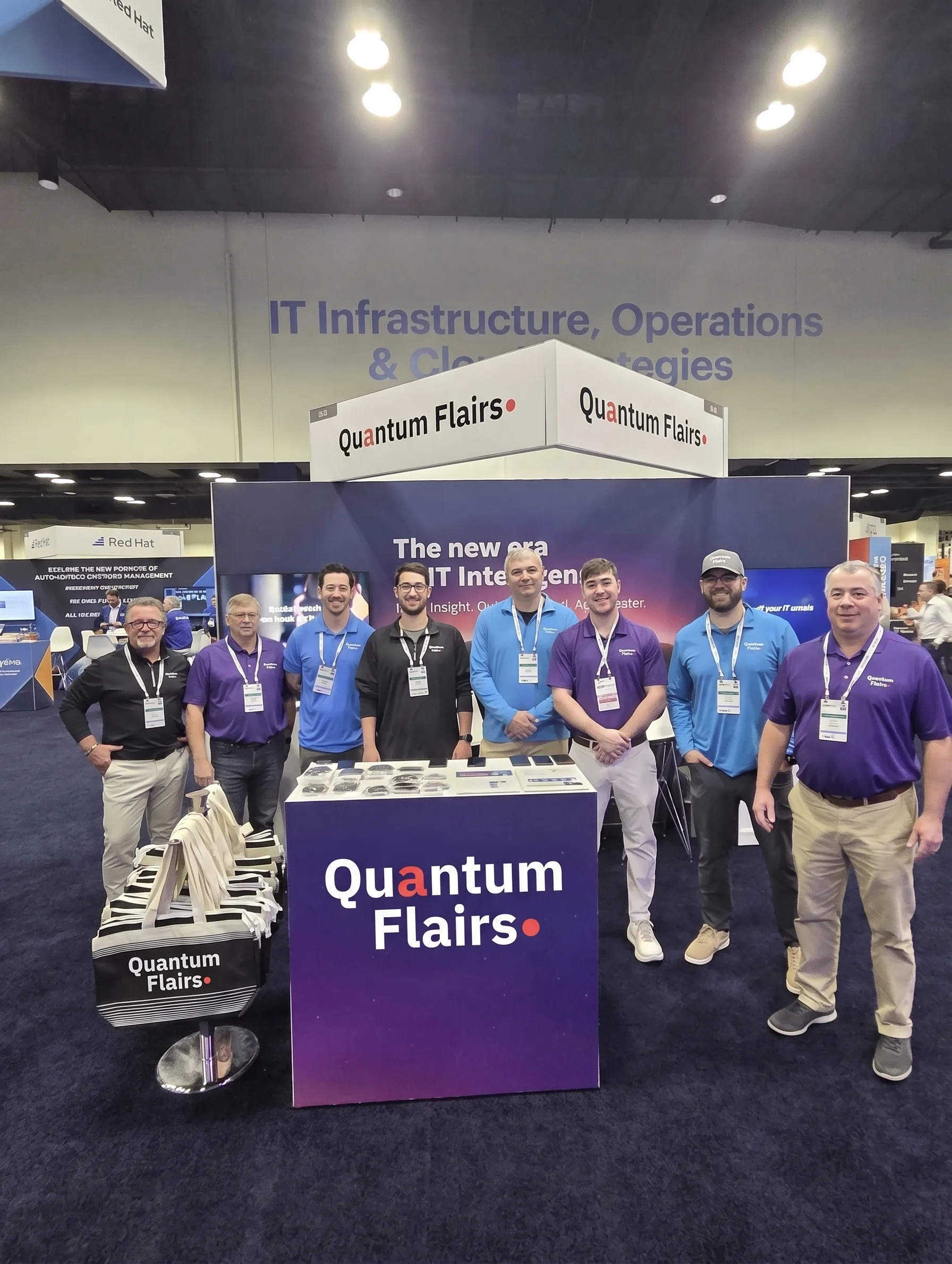 Quantum Flairs team standing at a conference booth